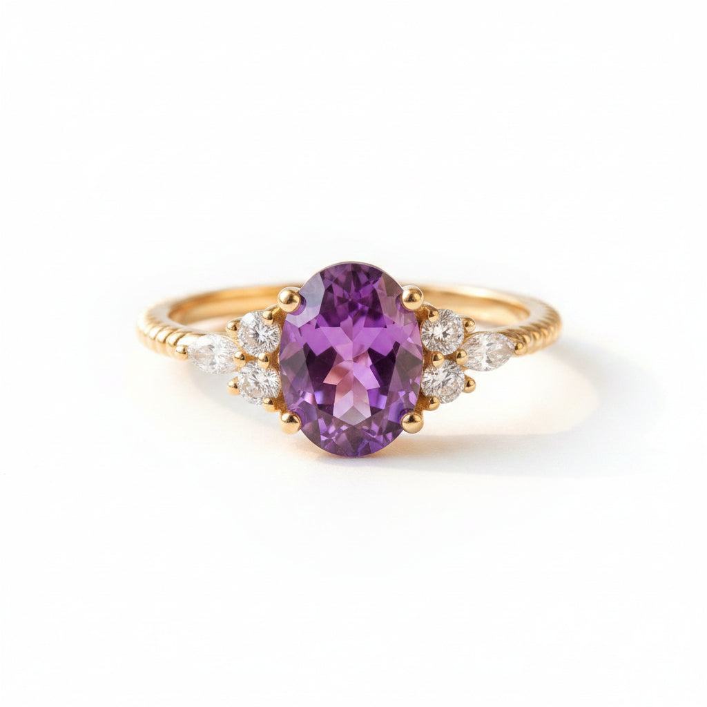 Gold ring with a purple gemstone on a textured fabric background