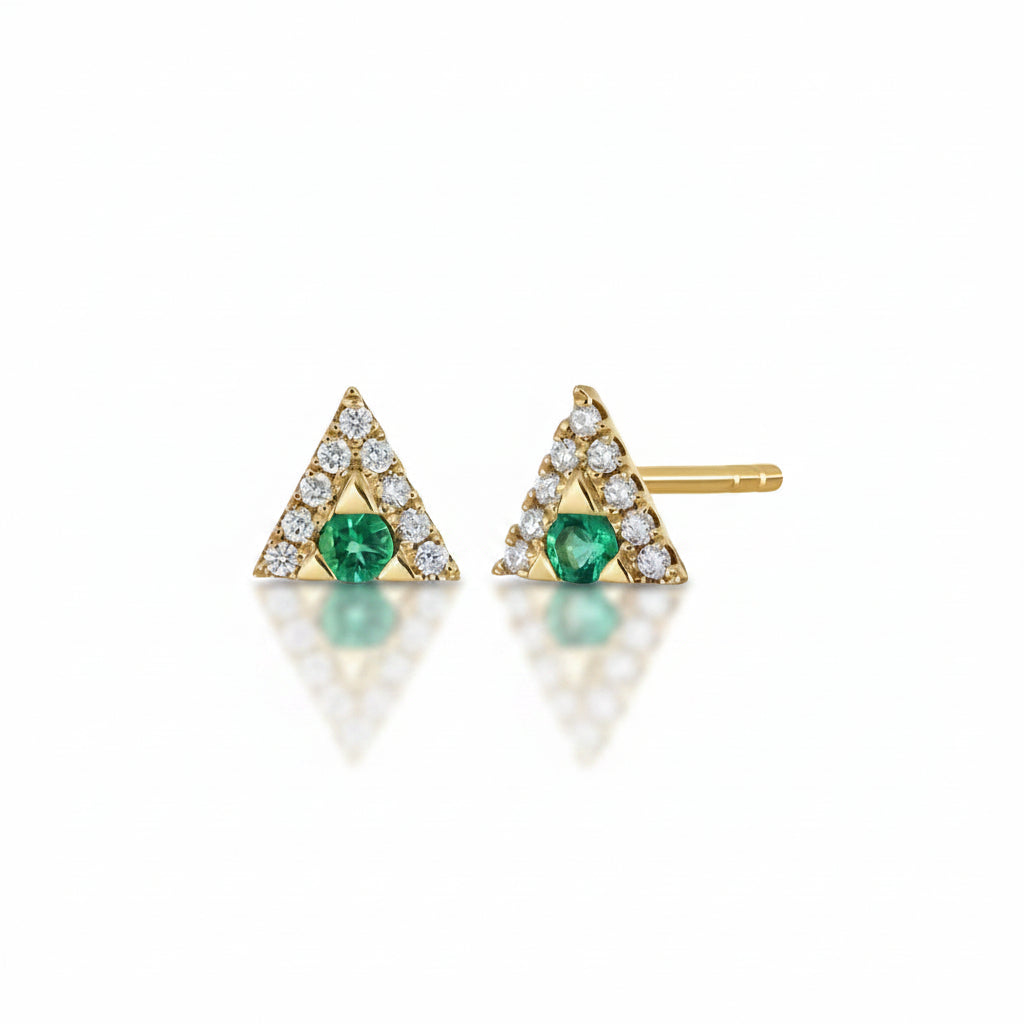 A pair of gold triangle stud earrings with a central green emerald and a border of small clear stones, shown on a white background with a faint watermark pattern.