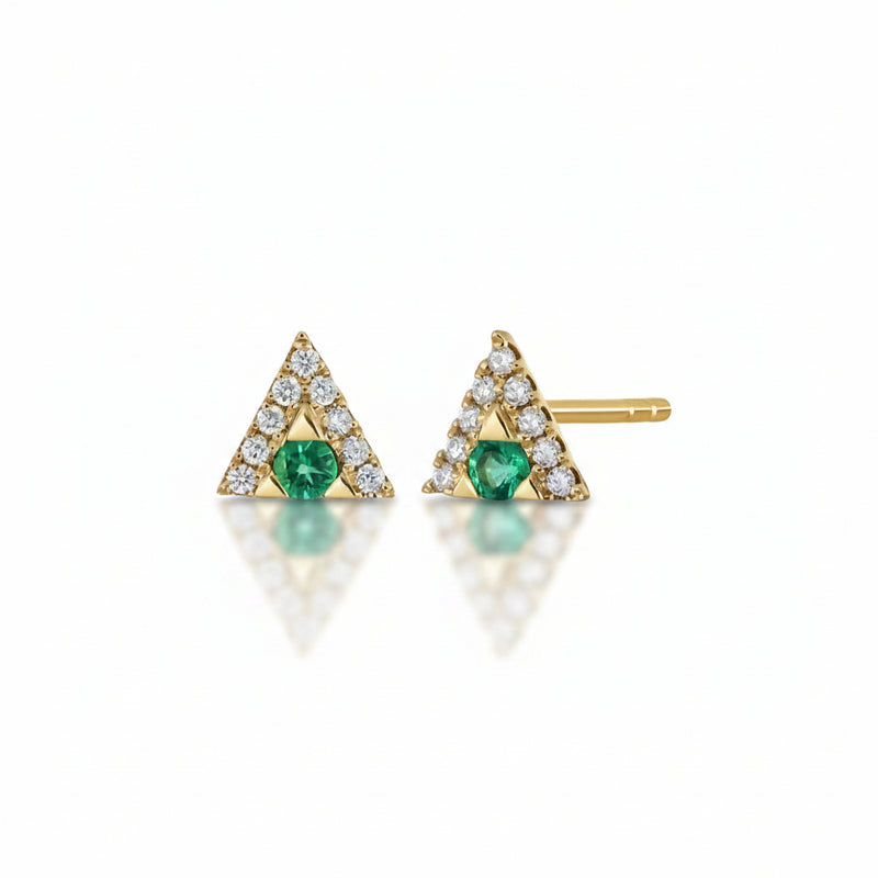 A pair of gold triangle stud earrings with a central green emerald and a border of small clear stones, shown on a white background with a faint watermark pattern.