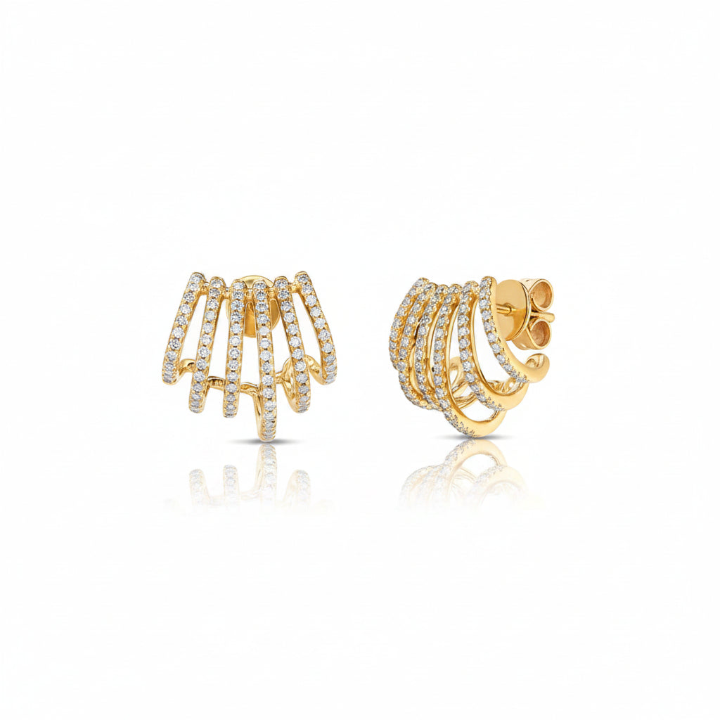 A pair of gold huggie hoop earrings adorned with pavé-set clear stones, shown from both front and side angles on a white background with a faint diagonal watermark pattern.