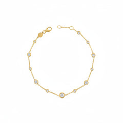 A delicate gold chain bracelet featuring multiple bezel-set round clear stones, displayed on a white background with a faint diagonal watermark pattern.