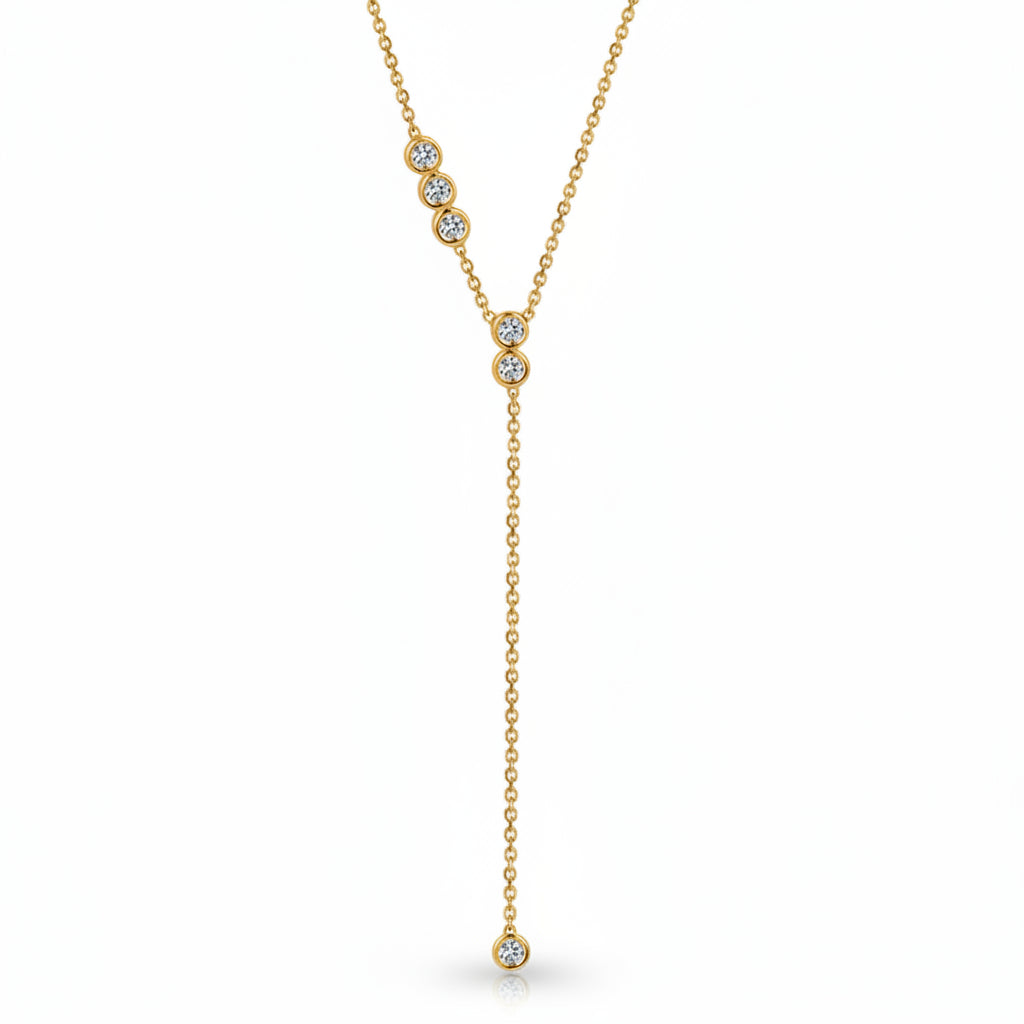 A gold Y-shaped necklace with three clear round-cut gemstones on the upper chain and one dangling gemstone at the bottom, shown on a white background with a faint diagonal watermark pattern.