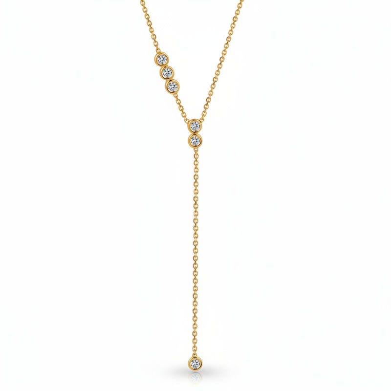 A gold Y-shaped necklace with three clear round-cut gemstones on the upper chain and one dangling gemstone at the bottom, shown on a white background with a faint diagonal watermark pattern.