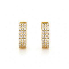 A pair of gold huggie hoop earrings paved with small clear cubic zirconia stones, shown from front and side angles on a white background with a faint watermark pattern.
