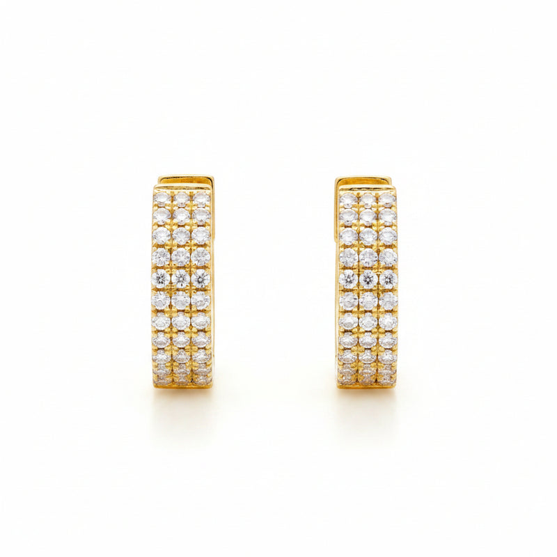 A pair of gold huggie hoop earrings paved with small clear cubic zirconia stones, shown from front and side angles on a white background with a faint watermark pattern.
