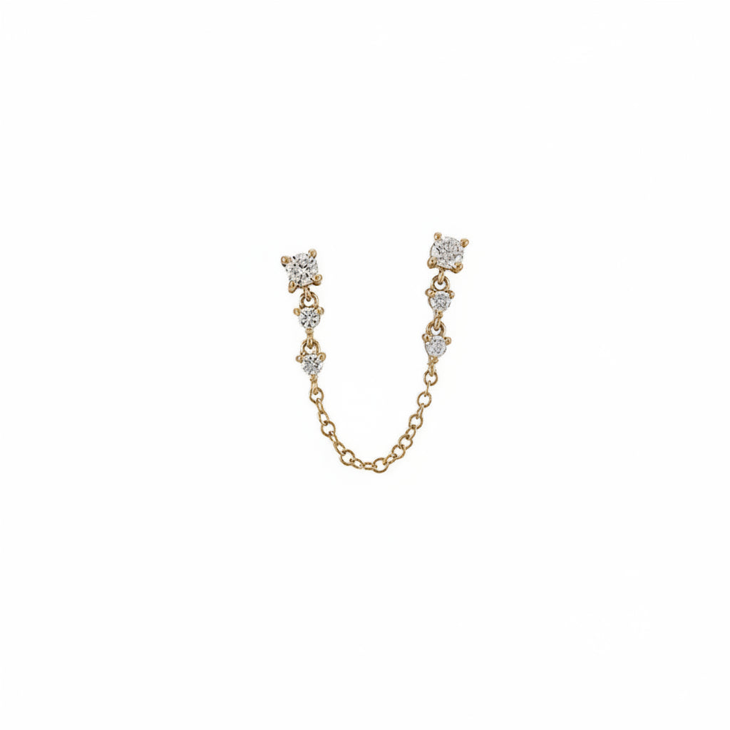 A gold-toned U-shaped chain earring accessory featuring three small round clear gemstone clusters at each end and a short connecting chain, shown on a white background with a faint diagonal watermark pattern.