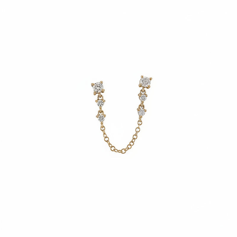 A gold-toned U-shaped chain earring accessory featuring three small round clear gemstone clusters at each end and a short connecting chain, shown on a white background with a faint diagonal watermark pattern.