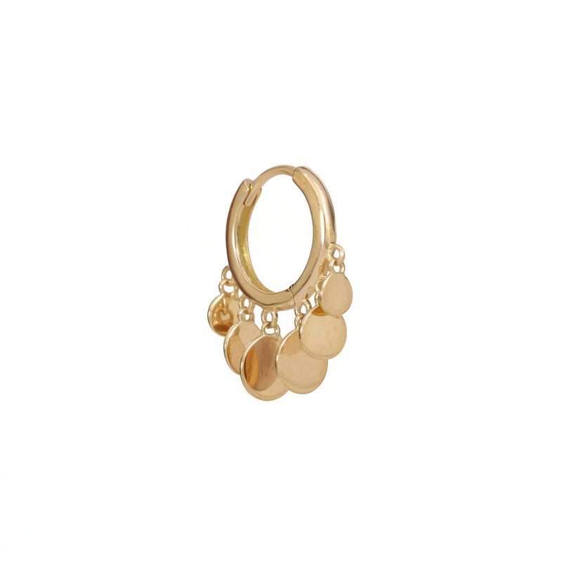 A gold huggie hoop earring with dangling disc charms, shown on a light pink background with a repeating 'MINIMAL ATELIER' watermark.