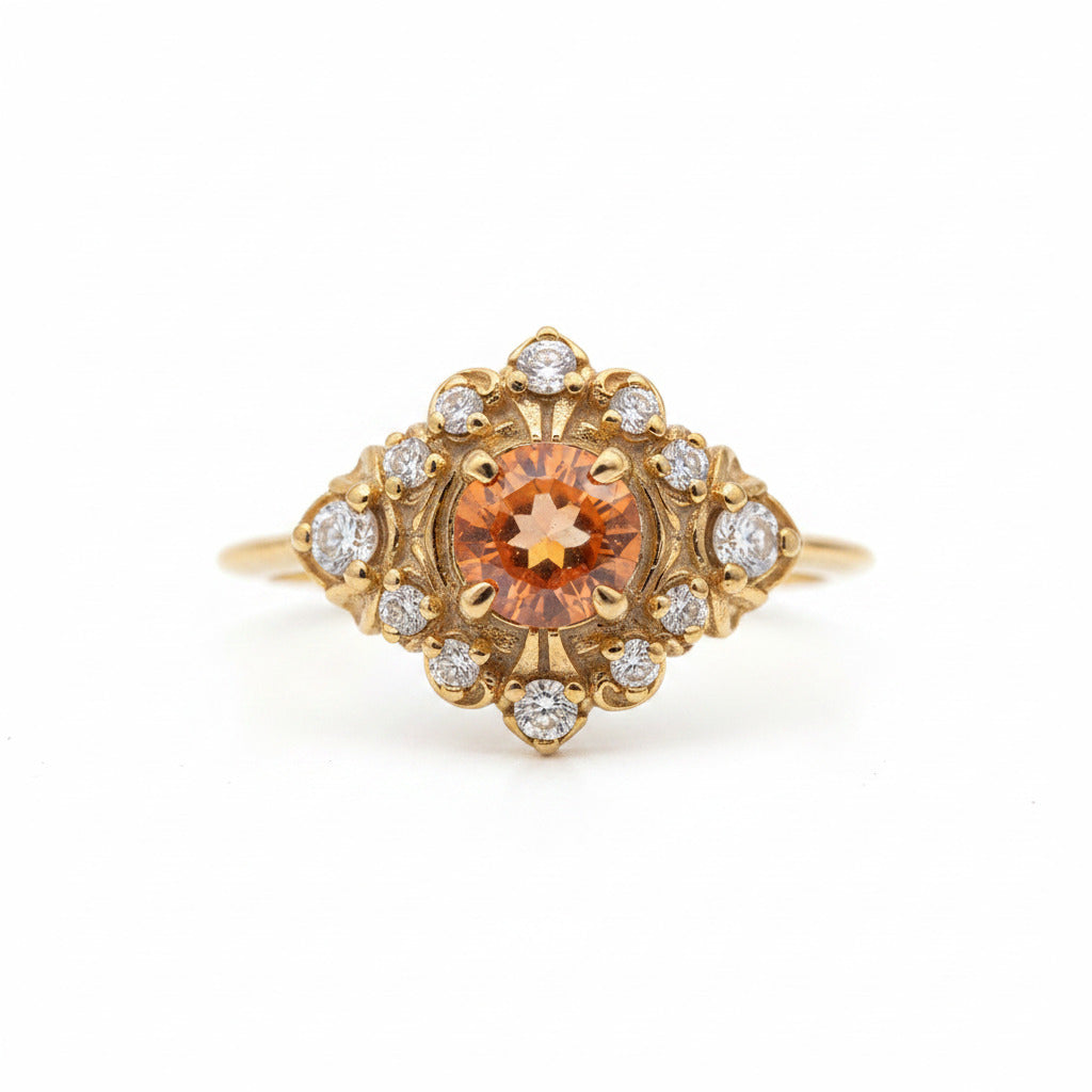 A yellow gold ring featuring a prominent round orange gemstone in the center, surrounded by a halo of small clear stones, set against a light gray background with a repeating watermark.