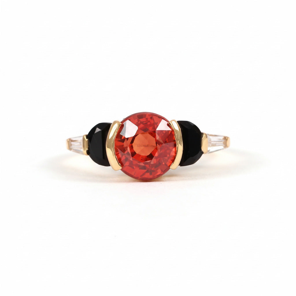 A ring featuring a large, faceted red gemstone in a gold setting, flanked by two black oval stones and small clear accent stones, shown on a light gray background with a repeating watermark.