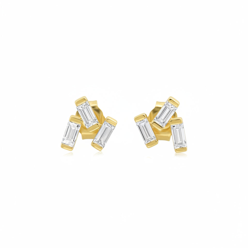 A pair of gold stud earrings with baguette-cut clear gemstones, shown from both the front and side angles against a white background with a faint diagonal watermark pattern.
