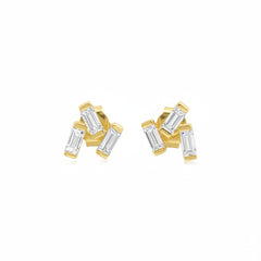 A pair of gold stud earrings with baguette-cut clear gemstones, shown from both the front and side angles against a white background with a faint diagonal watermark pattern.