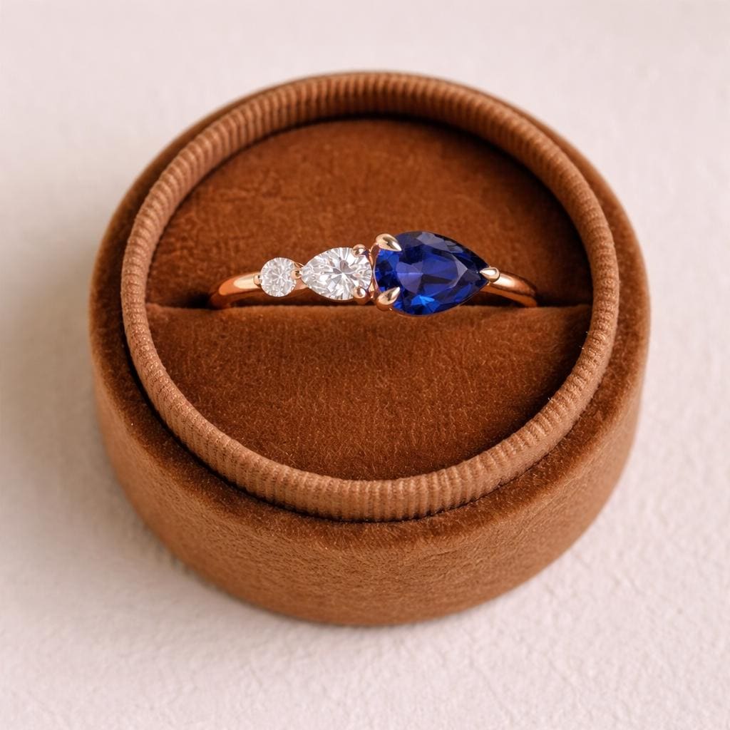 Dainty Pear Cut Blue Sapphire & Moissanite Three Stone Ring
