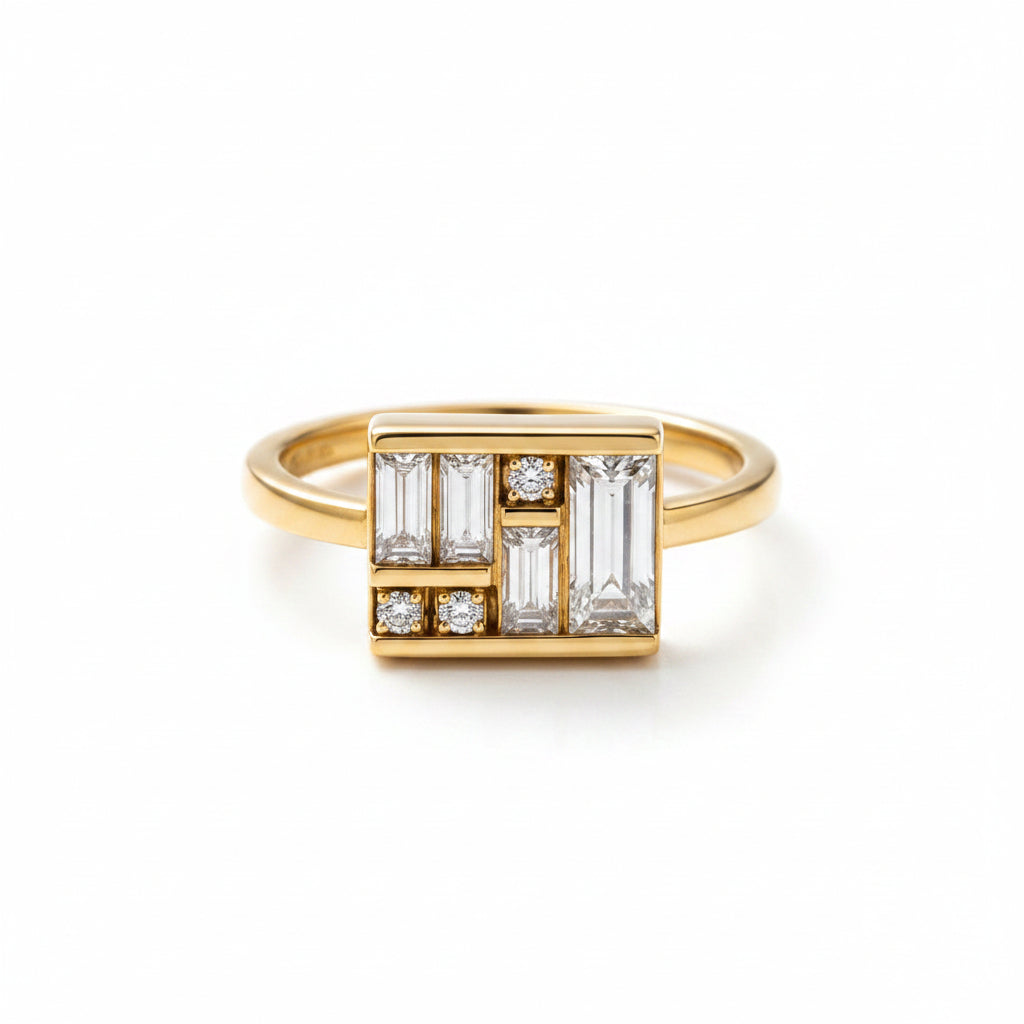 A gold ring with a geometric diamond cluster setting, featuring baguette and round-cut clear stones, resting on a dark, wet textured surface.
