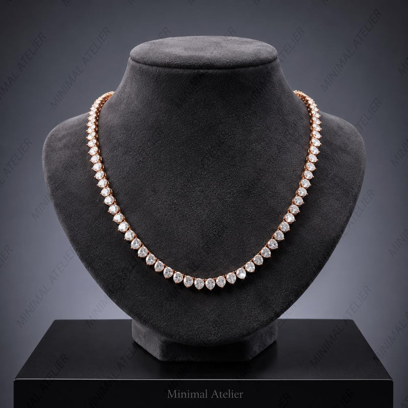A double-row diamond tennis necklace in rose gold, displayed on a black velvet jewelry bust against a dark gray gradient background.